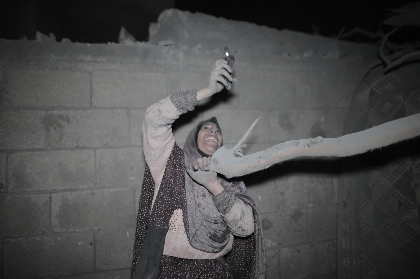 Palestinian Woman Emerged from Under the Rubble of her Home